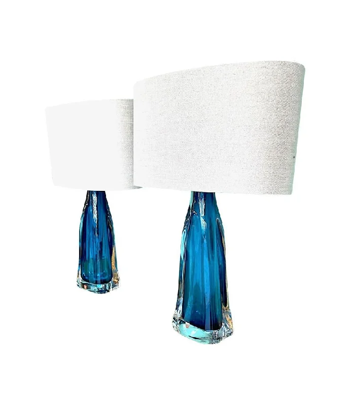 industrial style table lamps with exposed bulbs for loft apartmentsindustrial style table lamps with exposed bulbs for loft apartmentsA pair of 1960s Orrefors turquoise glass and brass lamps with new bespoke linen shades